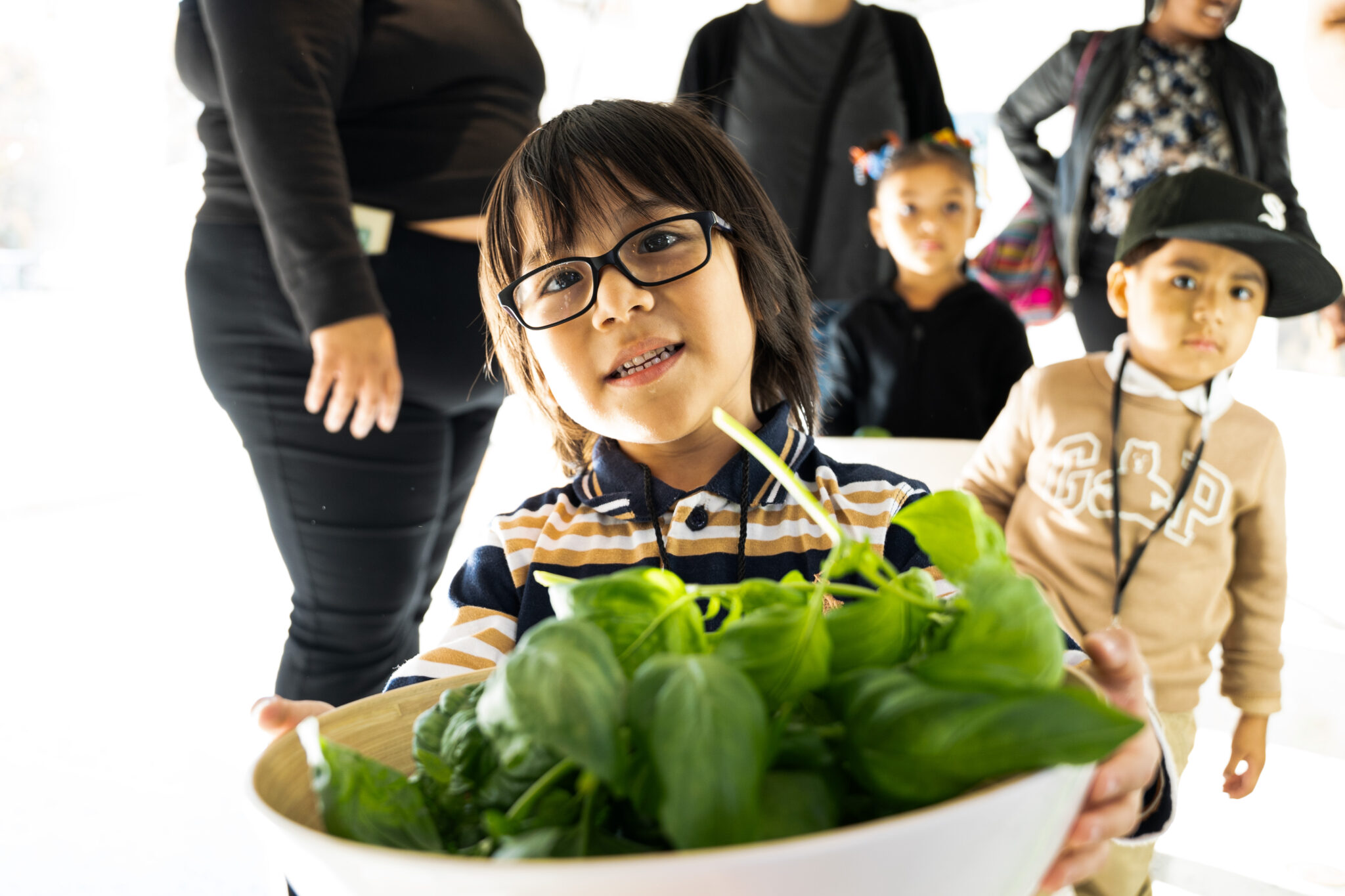 Students demonstrate their harvest at the NYSCI exhibit.