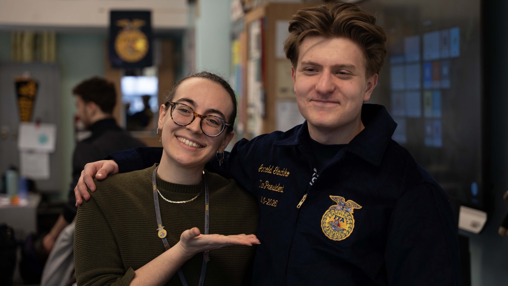 Hannah O'Leary and student Arnold after Arnold receives FFA jacket at Rachel Carson School
