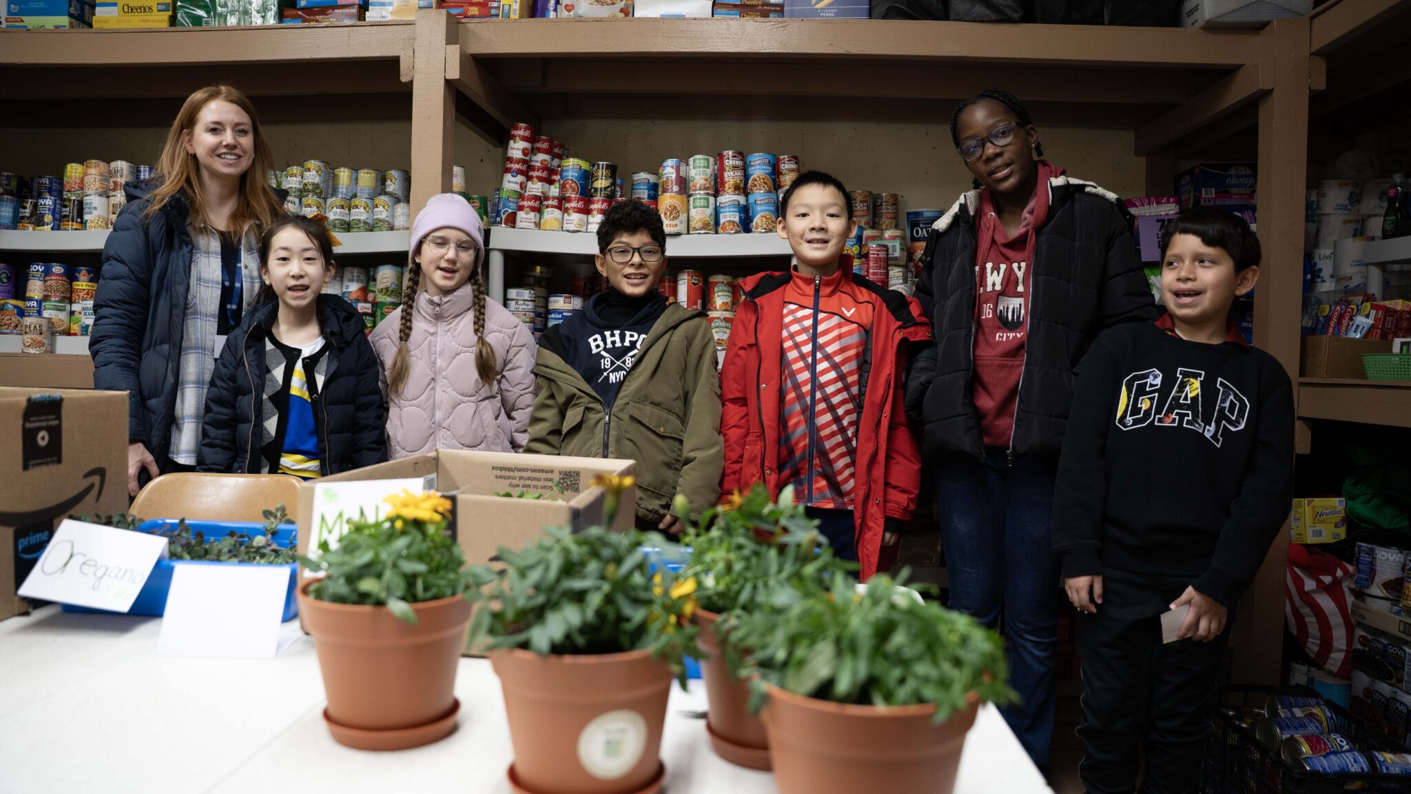 PS 144Q students at a local pantry donation